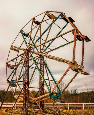 Every time I pass by this place I say I need to stop. The last time I did the gate was closed and locked, so I couldn't get inside, but this time the gate was open.
You can see it from the expressway. It used to be a gas station and fireworks store, but now it is just an empty lot with a couple old ferris wheels and other carnival equipment. It is very eerie and beautiful though, if you see it I'd stop and walk around a minute.