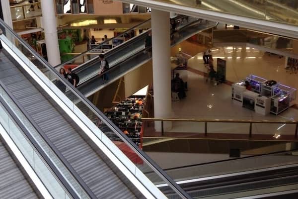 Travelators carrying folks from one level to the next to the next. Lol. Travelators, ha ha ha. Such a funny name. Pretty cool that you can push a trolley (grocery cart or basket) on one and it will stay put until its time to get off at the end.