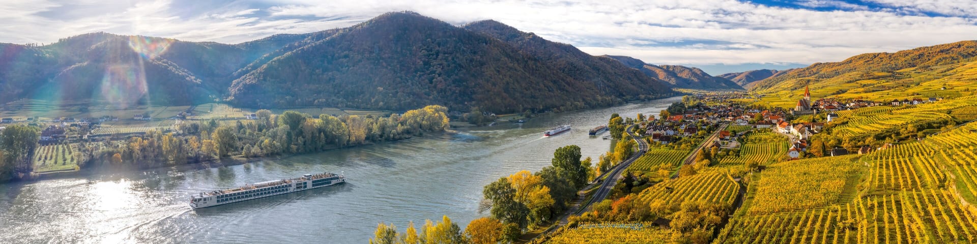 Autumn panorama of Wachau valley (Unesco world heritage site) with ships on Danube river near the Weissenkirchen village in Lower Austria, Austria