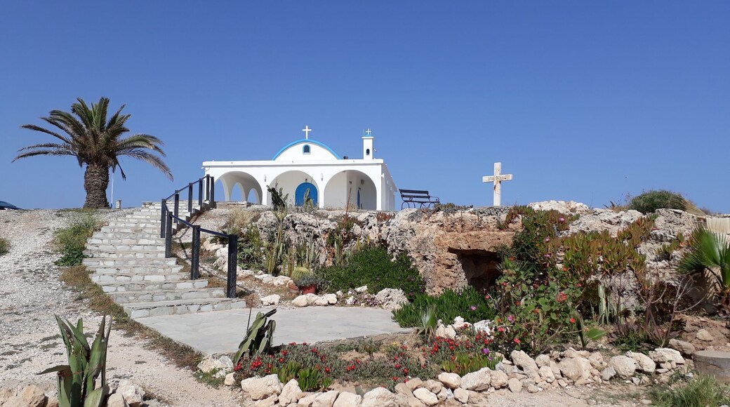 The holy first martyr Thekla is one of the most revered saints of the Christian church, one of the first nuns, her name is mentioned when women were tonsured as monks. Initially, there was a small cave chapel where residents of neighboring villages came to honor the memory of the Holy First Martyr Thekla, very revered and beloved on the holy island, to ask the Lord for intercession and teaching. And to this day you can go into this chapel, going down from the modern snow-white church to the beach. A new church was built today. The ancient icons that adorned the cave chapel, unfortunately, were stolen during the Turkish aggression of 1974, at present some of them are kept in the monastery of the Apostle Barnabas in Northern Cyprus.