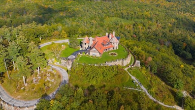 Castle in the Clouds aka Lucknow mansion aerial view in fall at the top of Lee Mountain with Lake Winnipesaukee and Ossipee Mountains at the background in town of Moultonborough, New Hampshire NH, USA