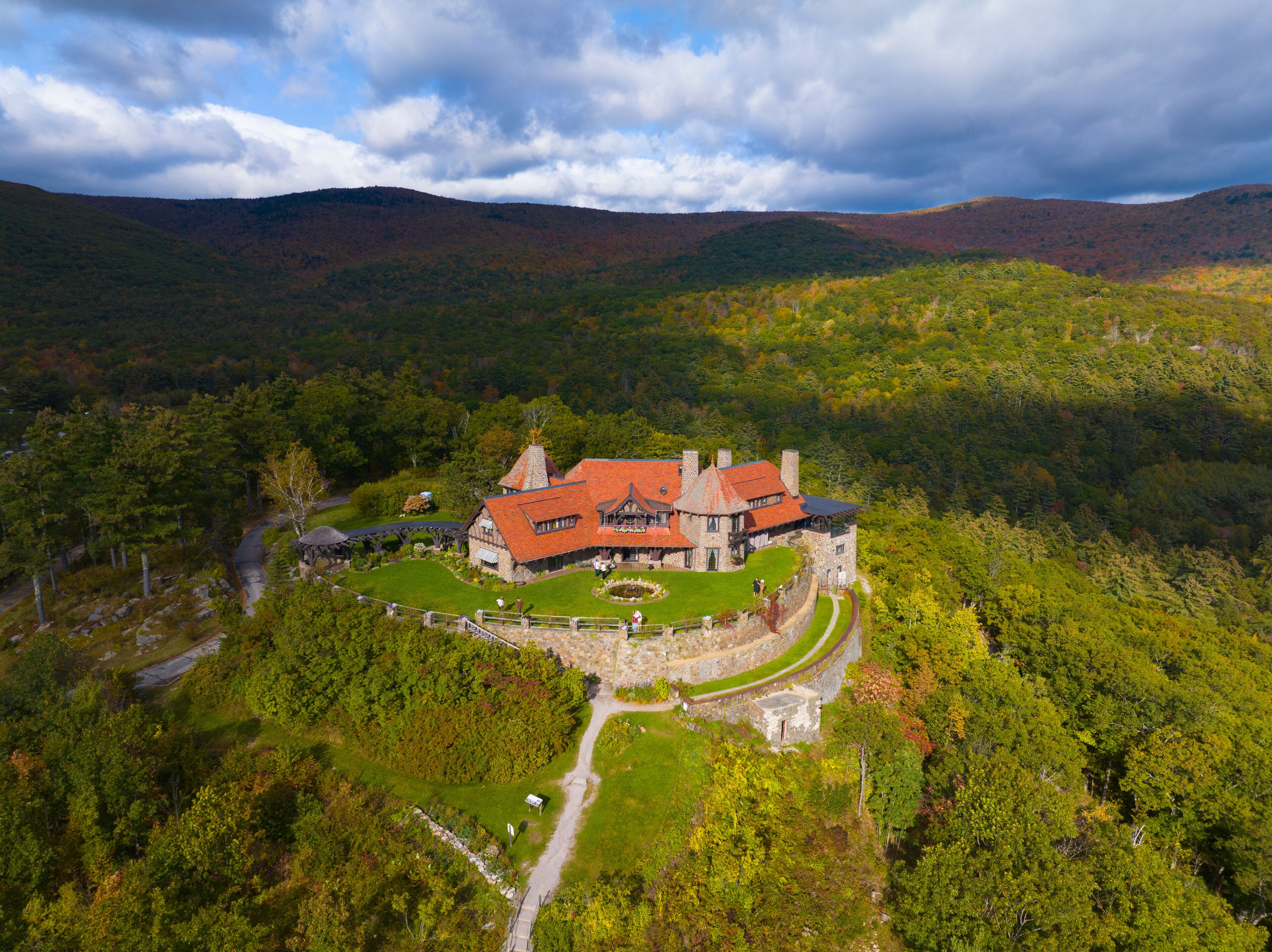 Castle in the Clouds aka Lucknow mansion aerial view in fall at the top of Lee Mountain with Lake Winnipesaukee and Ossipee Mountains at the background in town of Moultonborough, New Hampshire NH, USA