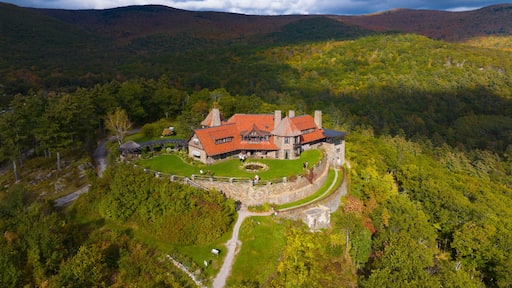 Castle in the Clouds aka Lucknow mansion aerial view in fall at the top of Lee Mountain with Lake Winnipesaukee and Ossipee Mountains at the background in town of Moultonborough, New Hampshire NH, USA