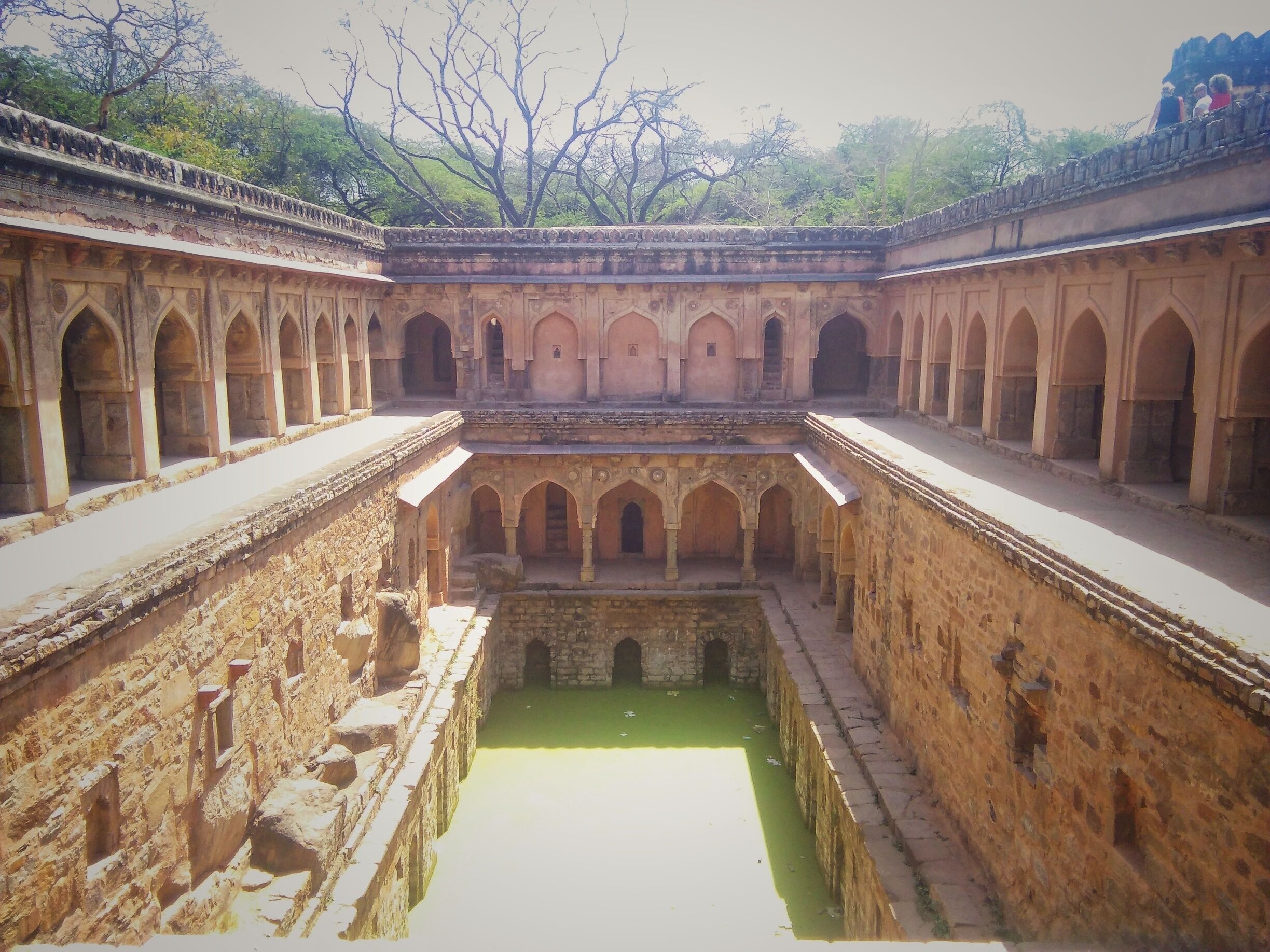 Rajon ki baoli is a stepwell dating back to 1506, built by Daulat Khan of Lodi era.  Built to store water for dry summers, it was also a respite from the heat of the day for many travellers of the period. 
Located in the heart of Mehrauli, it is surrounded by constructions of the bygone era, evoking a beautiful feeling of history. 