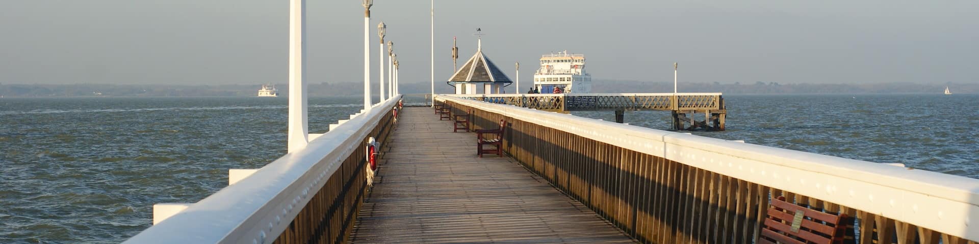 Yarmouth Pier Looking along Yarmouth Pier. Two Isle of Wight ferries can be seen, going and coming. http://www.theheritagetrail.co.uk/piers/yarmouth%20pier.htm