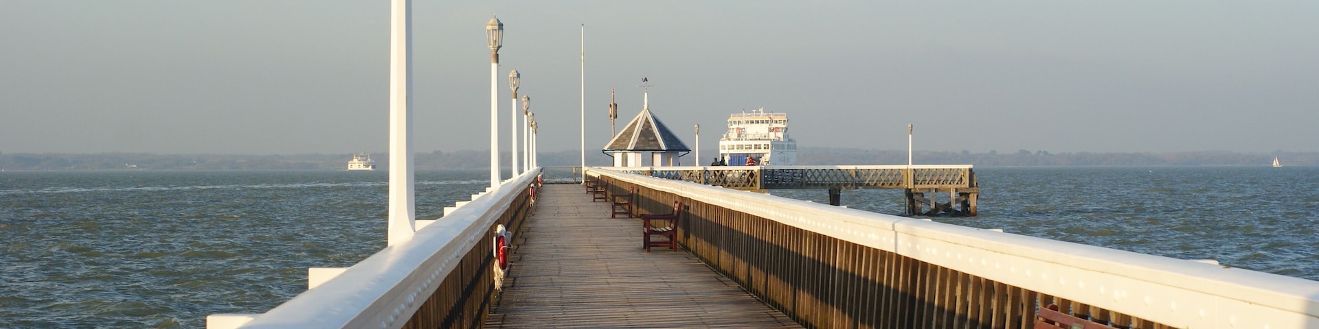 Yarmouth Pier Looking along Yarmouth Pier. Two Isle of Wight ferries can be seen, going and coming. http://www.theheritagetrail.co.uk/piers/yarmouth%20pier.htm