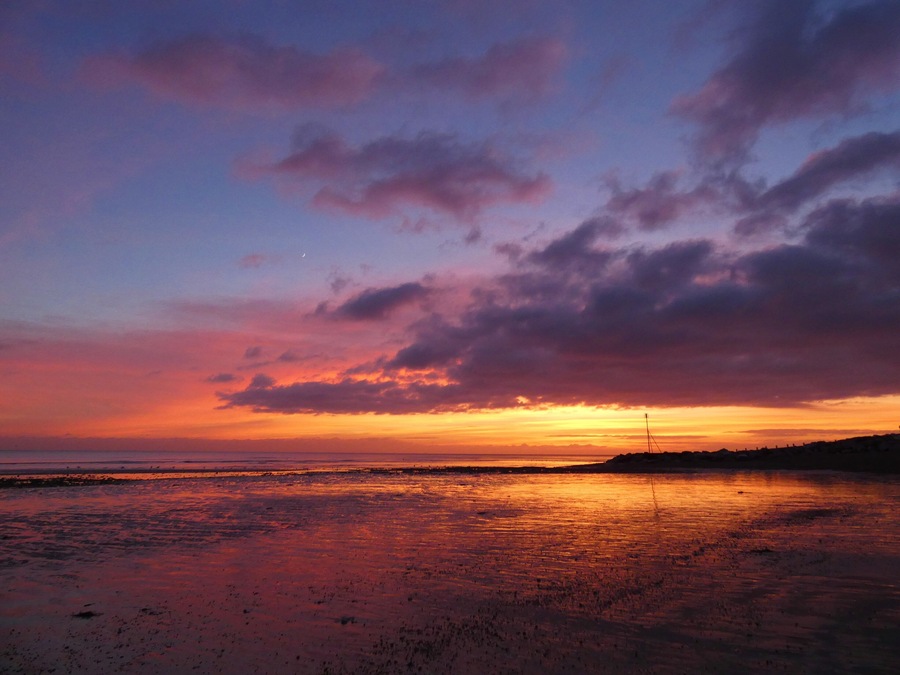 On the south coast, this beach lined by white beach huts gets great sunsets. #perspective