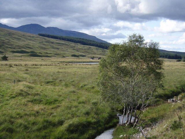 Looking back up Glen Cassley Looking across the flood plain and towards the head of the glen. The ruin is Dalnaclave.