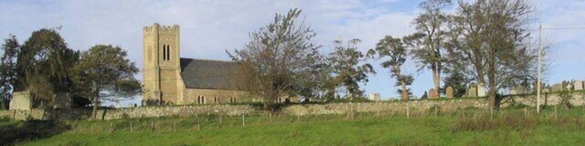 The Parish Church of St Cuthbert at Carham Viewed from a field to the South of the church. The church dates back to 1790.