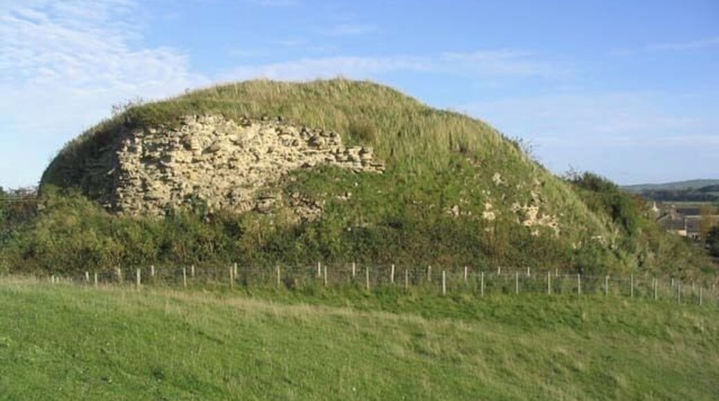 The keep at Wark Castle This large keep on the motte of Wark Castle is now mostly rubble, barely defining the line of the keep walls below a blanket of scrub. The castle dates back to the early 12th century. (Source: Borders and Berwick, An Architectural Guide by Charles Alexander Strang)