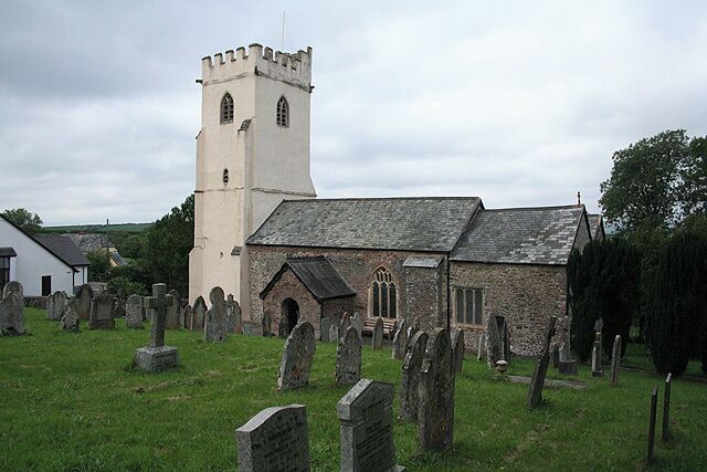 A church with a tower and a graveyard.