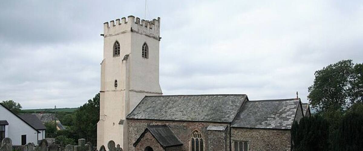 A church with a tower and a graveyard.