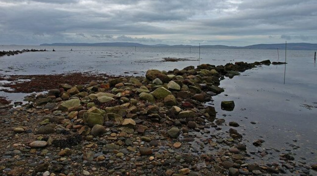Shore at Blackwaterfoot, Arran The rocky shore near the small harbour entrance. Kintyre in the distance.