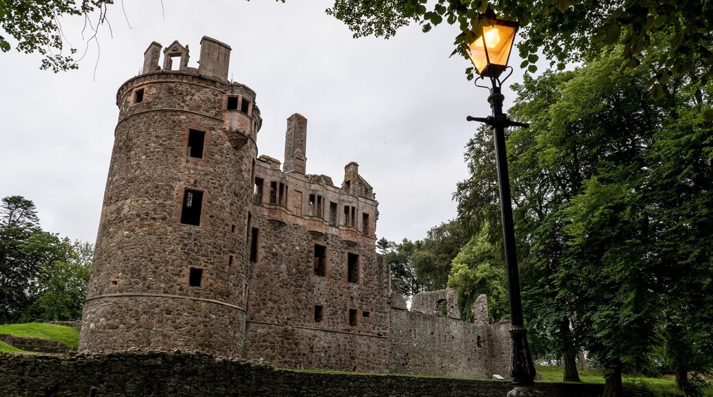 Legendary Huntly Castle in Scotland in early evening with lamppost and the light on