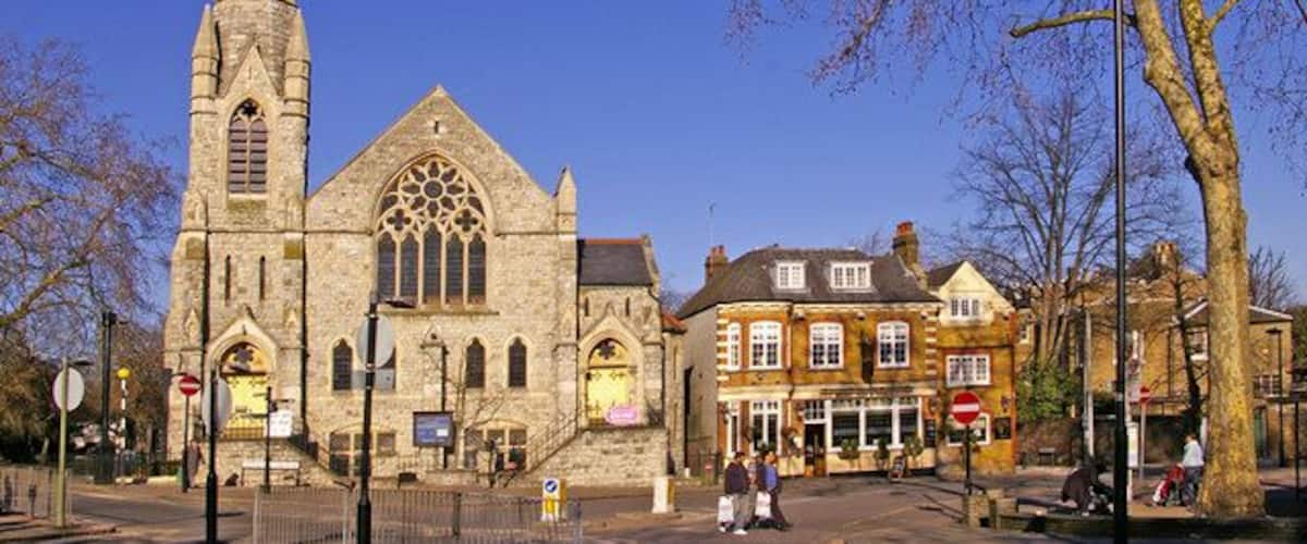 Trinity Church, Stag Public House and side of Register Office, Enfield Looking from across the road you can see Trinity Church on the left, the Stag public house and behind the tree the side of the Register Office, which is actually located in Gentleman's Row, backing on to Little Park Gardens.