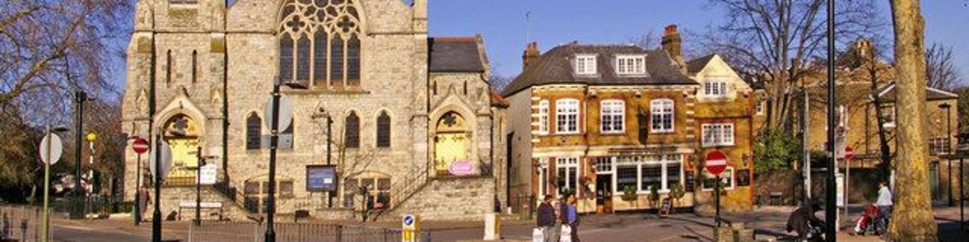 Trinity Church, Stag Public House and side of Register Office, Enfield Looking from across the road you can see Trinity Church on the left, the Stag public house and behind the tree the side of the Register Office, which is actually located in Gentleman's Row, backing on to Little Park Gardens.
