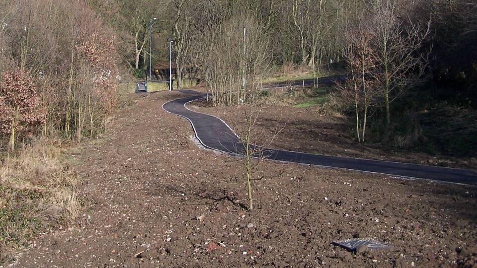 New Path at Middlewood, Middlewood Road North, Sheffield. A new footpath has been laid, running from the gate entrance on Middlewood Road North to the Wadsley Park Village estate ... I assume that the soil will be grassed over in the future. The gate entrance is just visible under the lamp post ... now fitted with a security infill to stop Motorbikes getting through. 747099 1734424
