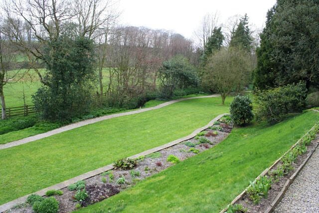 Gardens at Mitton Hall. The terraced gardens lead down to a small stream which joins the River Ribble off towards the left of the photograph.