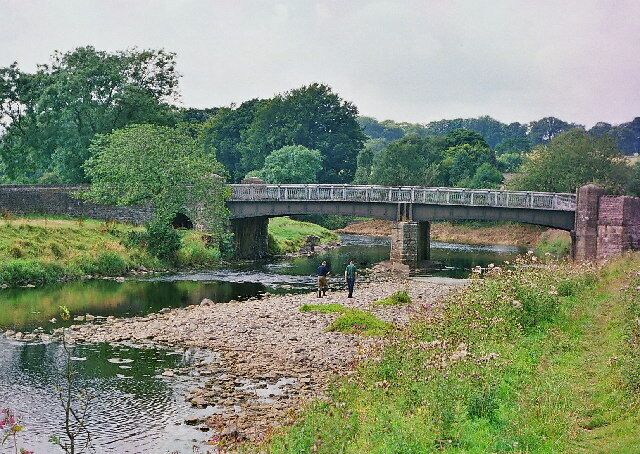 Bridge over the Ribble near Grindleton. The river is very low. The two men are from the Environment Agency looking for otter spraints (faeces) to monitor the return of the otter to this river.