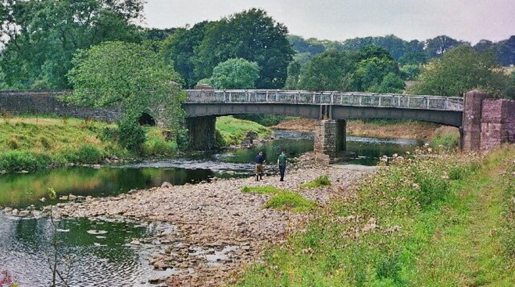Bridge over the Ribble near Grindleton. The river is very low. The two men are from the Environment Agency looking for otter spraints (faeces) to monitor the return of the otter to this river.