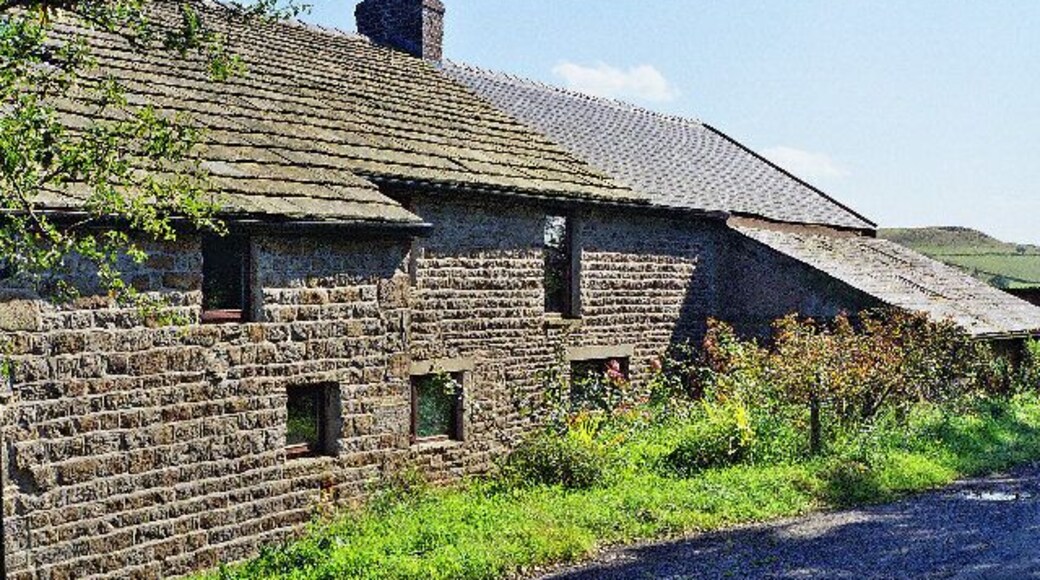 Farm on Shawcliff Lane. Modernised, but still barking dogs.