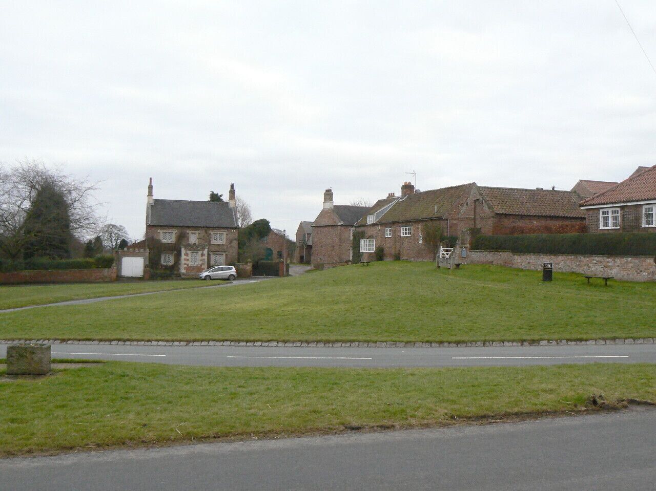 The Square, Aldborough This is the south side. Visible from left to right are Castle House, Stocks Cottage and the Old Court House. All of these are Listed grade II.