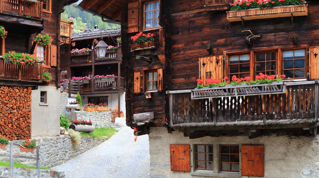 Most beautiful Swiss villages - pretty Griementz with traditional wooden houses and floral streets. popular tourist attraction in Valais Canton of Switzerland