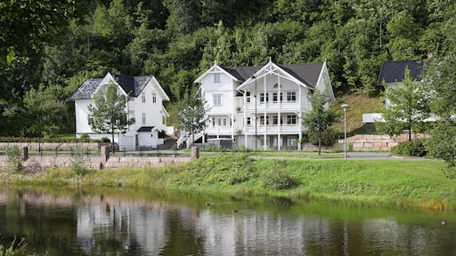 Old wooden architecture in Sandvika, Norway. White home