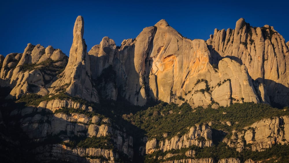 Montserrat mountain in a winter sunrise, seen from the north face, in Marganell (Barcelona province, Catalonia, Spain)