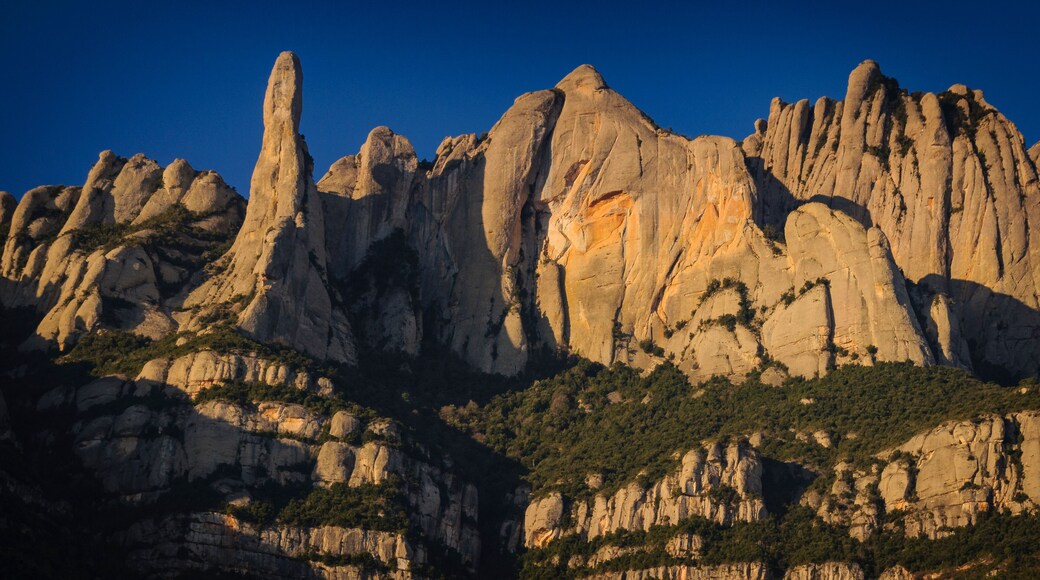 Montserrat mountain in a winter sunrise, seen from the north face, in Marganell (Barcelona province, Catalonia, Spain)