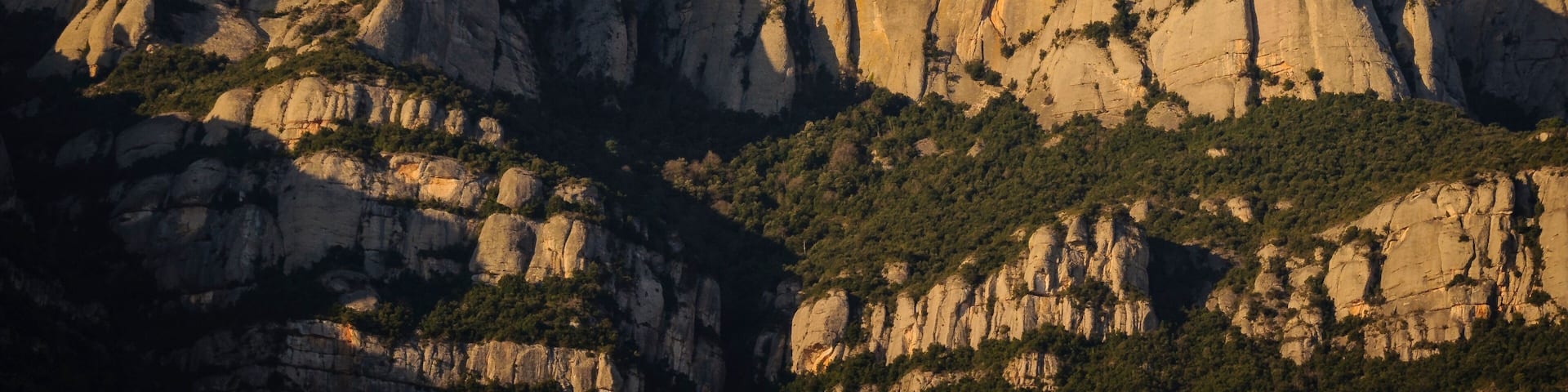 Montserrat mountain in a winter sunrise, seen from the north face, in Marganell (Barcelona province, Catalonia, Spain)