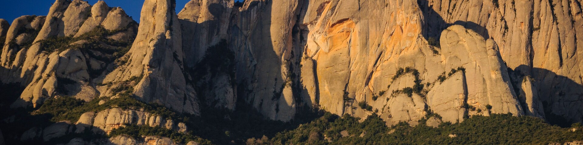 Montserrat mountain in a winter sunrise, seen from the north face, in Marganell (Barcelona province, Catalonia, Spain)