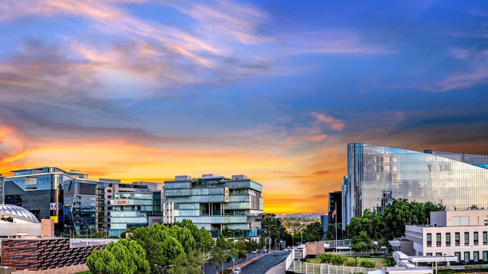 Panorama of Sandton City at sunset with colourful clouds