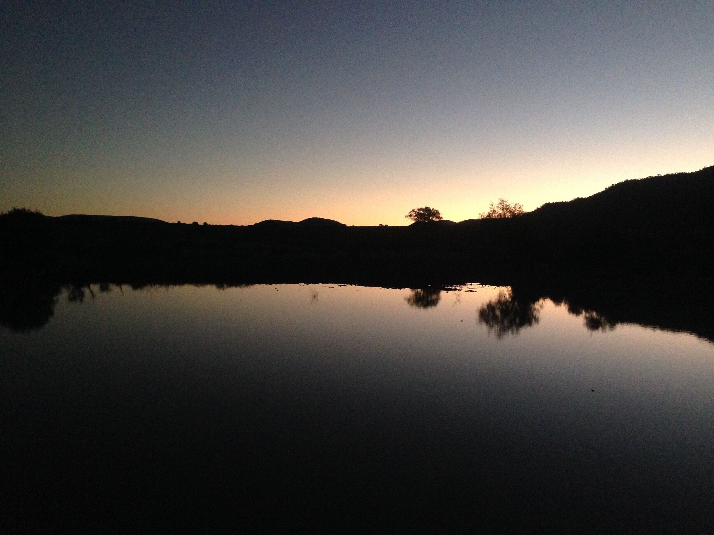 Glorious sunset view from Rathlogo Hide in Pilanesberg National Park. This spot is a popular watering hole for wildlife, including the occasional lion!