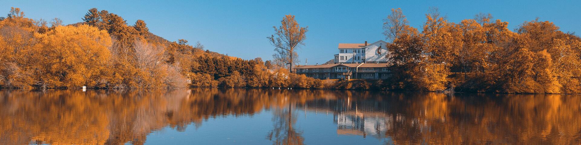 Autumn Colors Forest Woods Yellow Orange Reflecting on Blue Water Lake Landscape Natural Clear Weather Beautiful