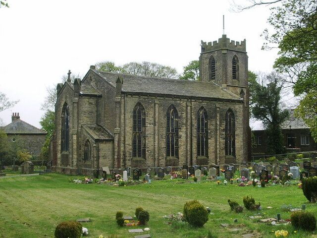 A historic church with a tall tower and arched windows.