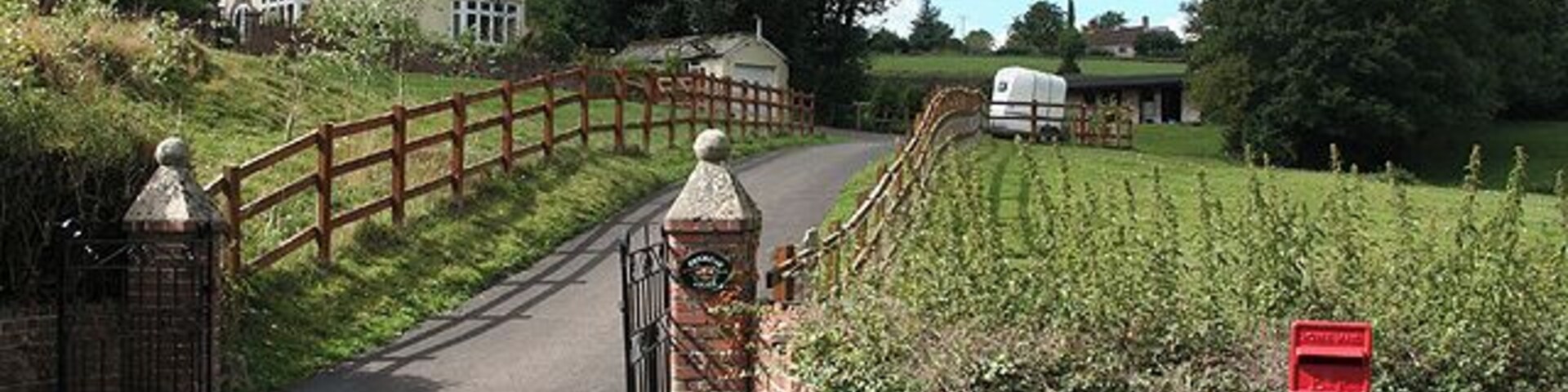 Cotleigh: Brookside Lodge. Seen from the Old Chard Road near Cotleigh Bridge. The bridge crosses the Umborne Brook which flows to Colyton. Looking north-north-west
