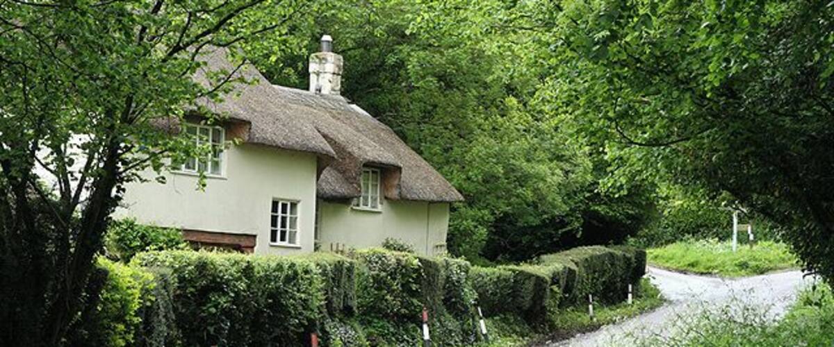 Broadhembury: cottage near Stafford Barton. The road ahead forks; that on the left leads to the head of the Tale valley whilst the main road climbs Stafford Hill to reach the top of the Blackdowns. Looking north east