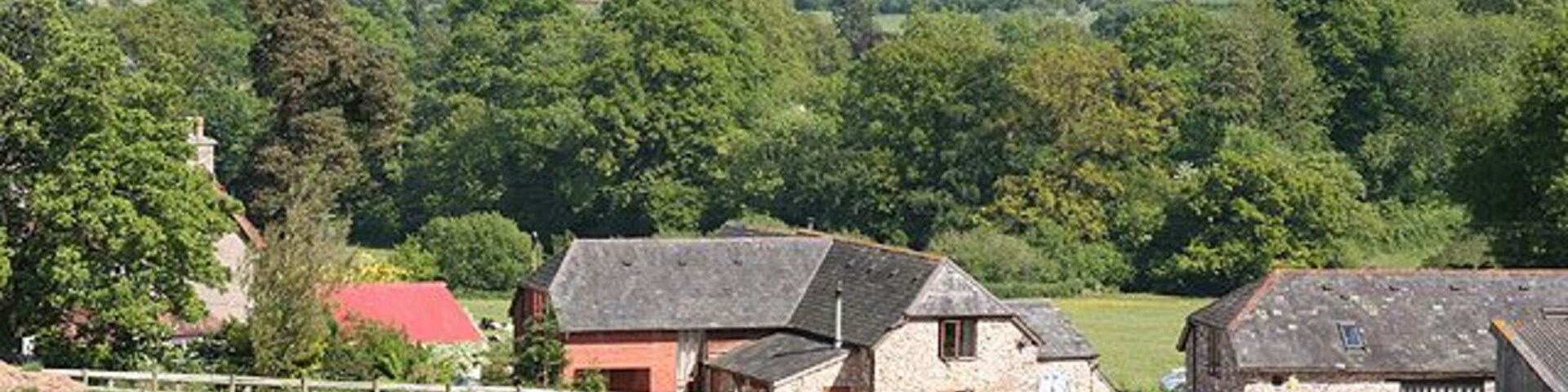 Upottery: overlooking Glebe Farm. Barns converted to residences. Looking south east