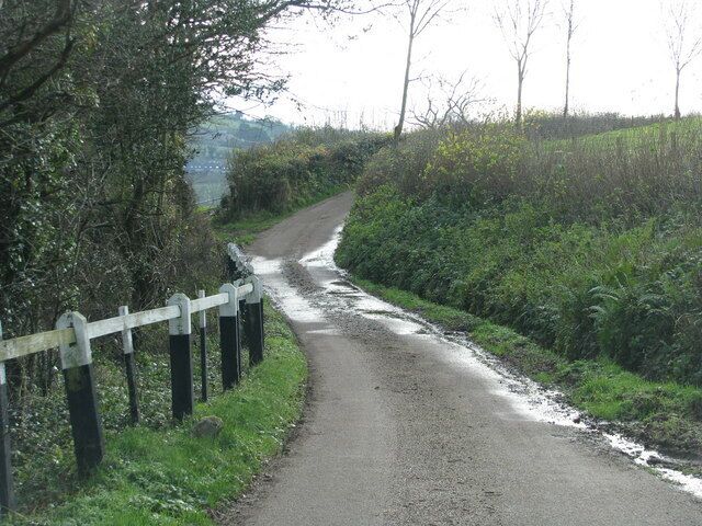 White-topped posts edge the lane below Greenway Manor