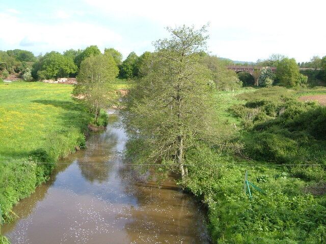 River Otter at Fenny Bridges. Looking upstream from Fenny Bridge. In the background is the Honiton-Exeter railway viaduct and bridge across the valley.