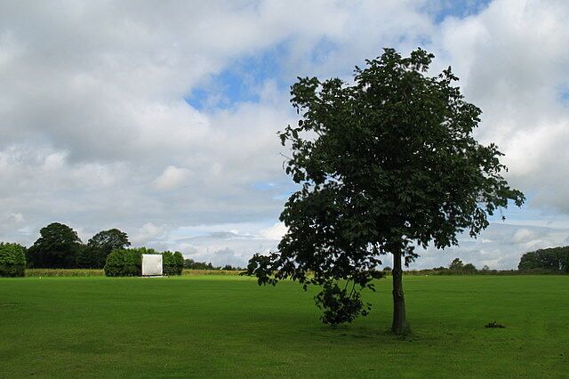 Birdlip & Brimsfield cricket pitch The sightscreen in the distance gives it away. A very scenic little cricket ground.