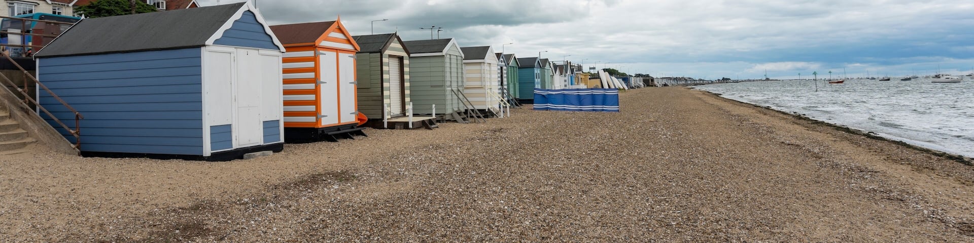 UK, Clacton 30 June 2023, Clacton-on-Sea, pretty pastel colored beach houses near the sea in Clacton, England