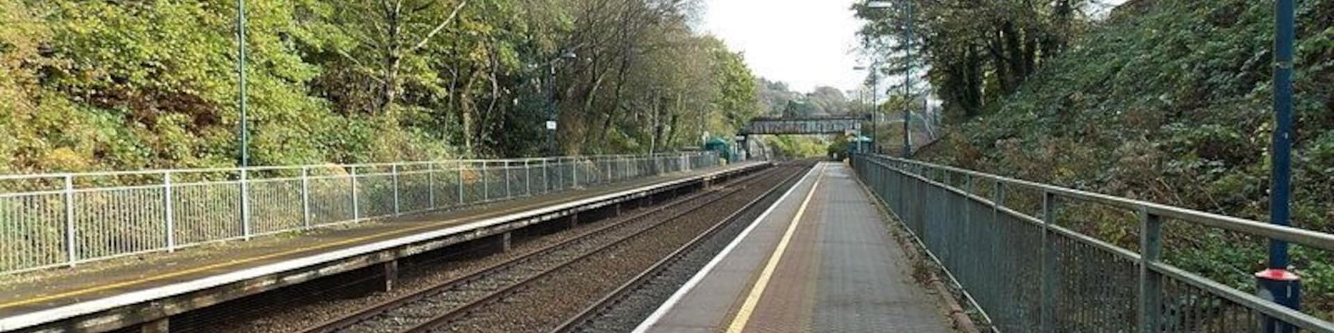 Skewen railway station from the west. Viewed from platform 1 looking towards Station Road bridge. This is an unstaffed station on the Swanline between Neath station and Llansamlet station.