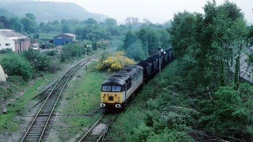Coal from Cwmgrach This is Neath and Brecon Junction.Once you could catch a train to Brecon straight ahead from the line on the left via Seven Sisters. Now this line is only open for coal which is loaded at the washery at Onllwyn.The line where the train is approaching leads to the open cast loading point at Cwmgwrach north of Resolven. The trees have grown here over the years.