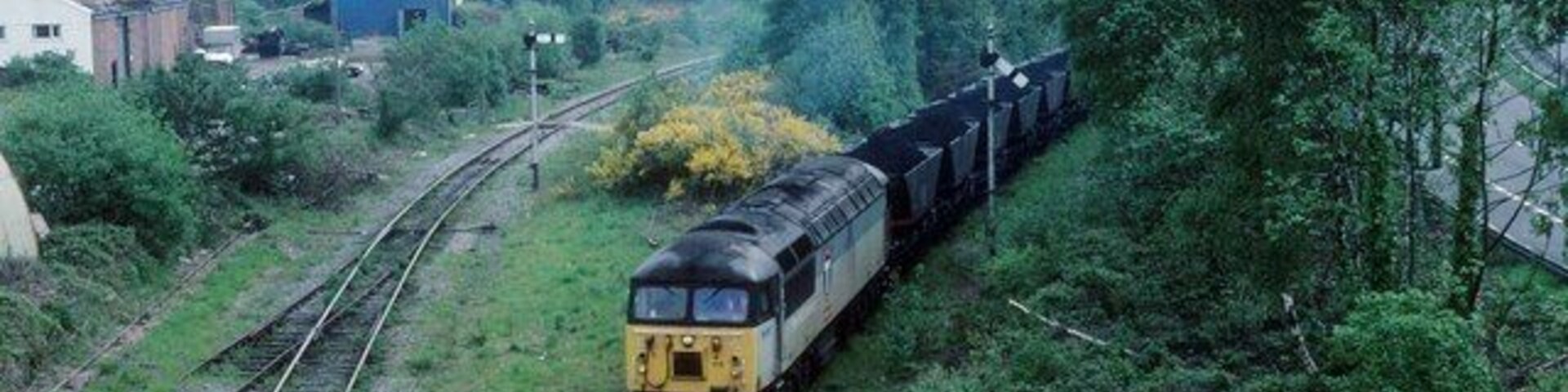 Coal from Cwmgrach This is Neath and Brecon Junction.Once you could catch a train to Brecon straight ahead from the line on the left via Seven Sisters. Now this line is only open for coal which is loaded at the washery at Onllwyn.The line where the train is approaching leads to the open cast loading point at Cwmgwrach north of Resolven. The trees have grown here over the years.