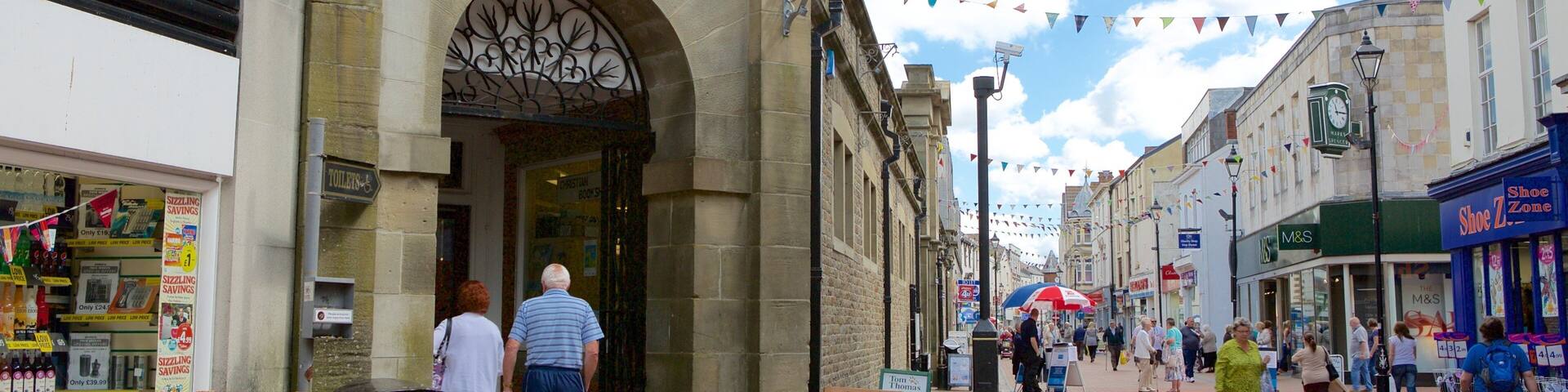 The entrance to Neath General Market with a sign above the door.