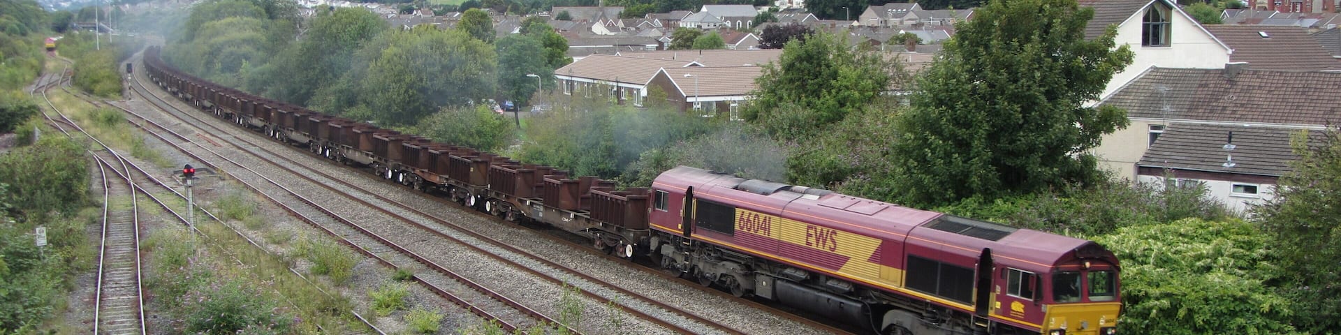 Freight train near Briton Ferry. An empty eastbound steel train heads away from Briton Ferry with locomotive No. 66041 in charge.