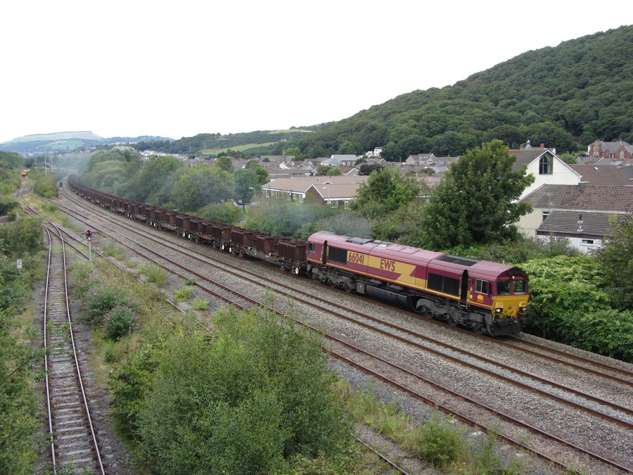 Freight train near Briton Ferry. An empty eastbound steel train heads away from Briton Ferry with locomotive No. 66041 in charge.