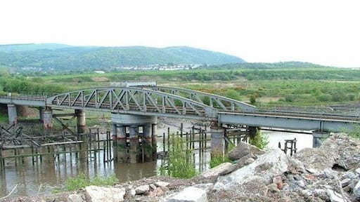 Neath Abbey Swing Bridge The Rhondda and Swansea Bay Railway Company opened its line in 1885, but could extend the line into Swansea until this swing bridge was completed in 1894. I am grateful to the owner of Derwent Construction and his plant operator Martin for their assistance in getting this image. This is one of over 1,450 movable bridges in the British Isles that I have identified for my historical website. www.movablebridges.org.uk